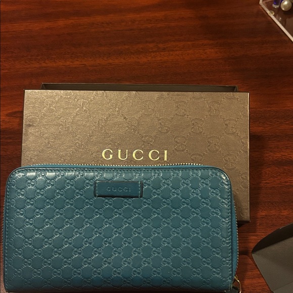Gucci Accessories - Gucci Teal Embossed Leather Wallet